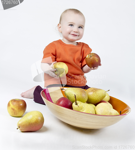Image of baby with apples