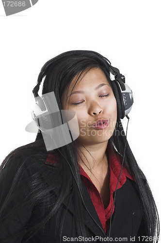 Image of woman listening to music over white background