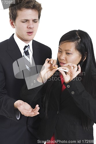 Image of woman breaking cigarette in half