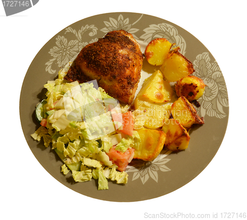 Image of Freshly baked potatoes and chicken with salad 