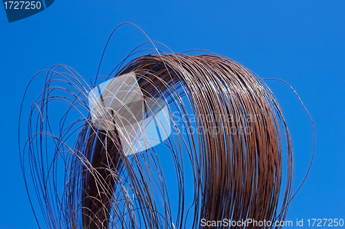 Image of Rusty wire against blue sky