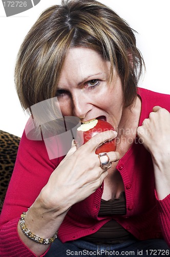 Image of woman eating and apple