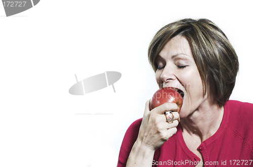 Image of woman eating and apple