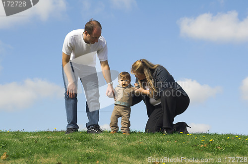 Image of mon and dad talking to son