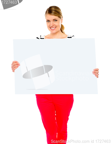 Image of Pretty lady displaying blank placard