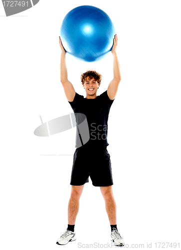 Image of Man with big ball over his head