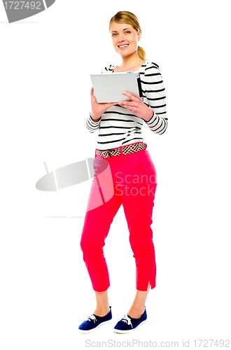 Image of Woman holding tablet computer