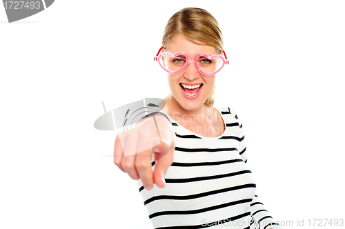 Image of Excited woman pointing at you