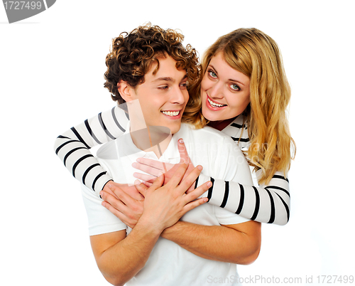 Image of Attractive young couple hugging each other