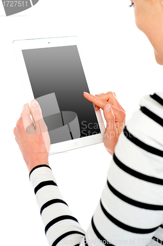 Image of Cropped image of smiling woman using tablet pc