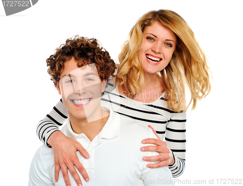 Image of Happy woman hugging man from behind