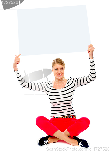 Image of Woman holding banner ad over her head