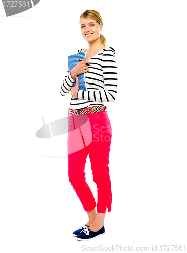 Image of Gorgeous lady posing with pen and notebook