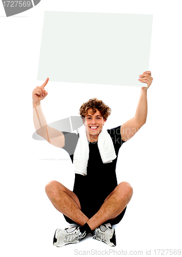 Image of Athlete pointing towards blank banner ad