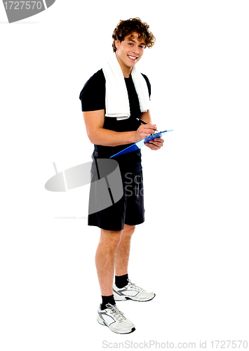 Image of Full length portrait of male fitness trainer