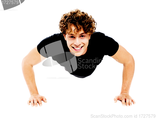 Image of Healthy young guy doing push-ups