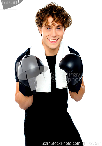 Image of Boxer boy in sports outfit ready to punch you