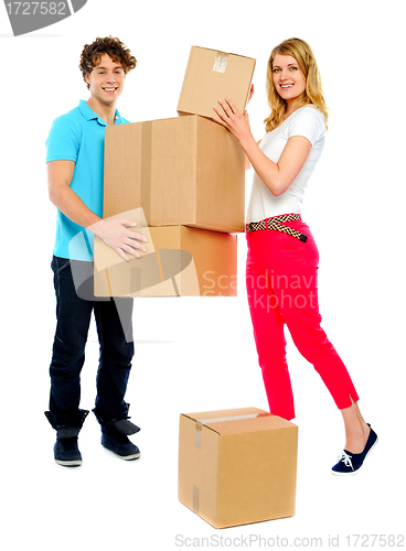 Image of Lovely couple holding cardboard boxes