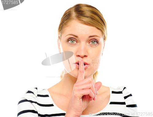 Image of Female with wide open eyes gesturing silence