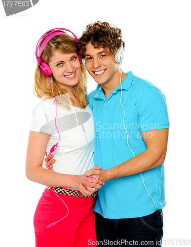 Image of Love couple enjoying music together