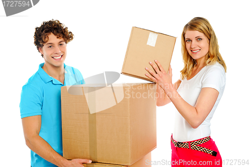 Image of Attractive caucasian couple holding cardboard boxes