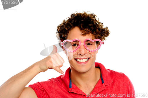 Image of Boy posing with heart shape eye-wear