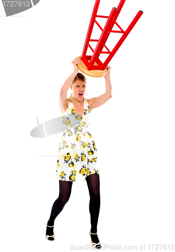 Image of Frustrated woman breaking stool
