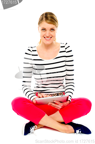 Image of Beautiful woman using her tablet pc