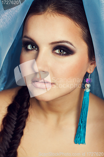 Image of Beautiful woman with blue color scarf