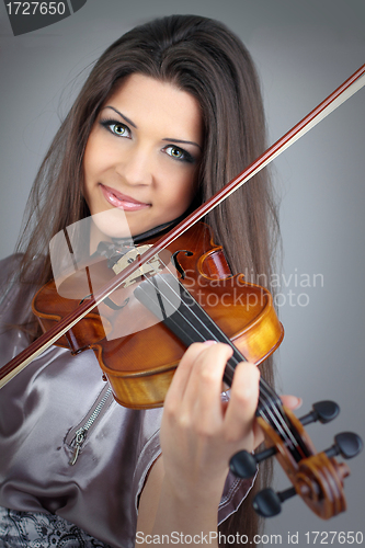 Image of beautiful girl playing violin