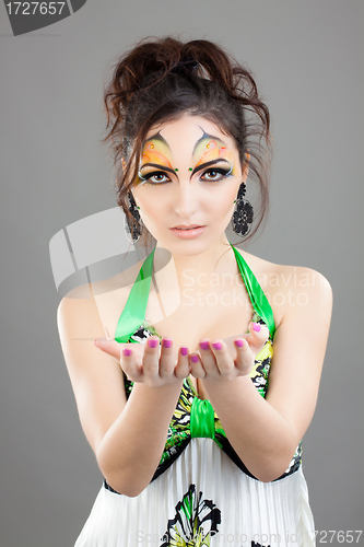 Image of Portrait of beautiful girl with idnian make up