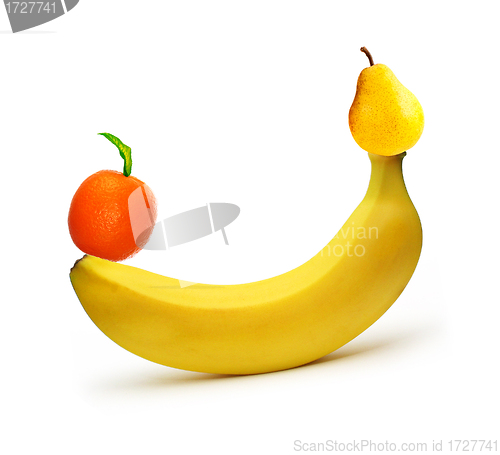 Image of banana and ripe pear with tangerine