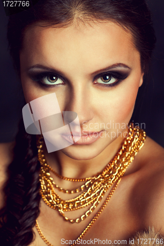 Image of Portrait of a beautiful woman with golden chains