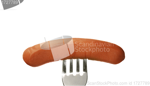 Image of Close up of sausage and fork isolated on white background