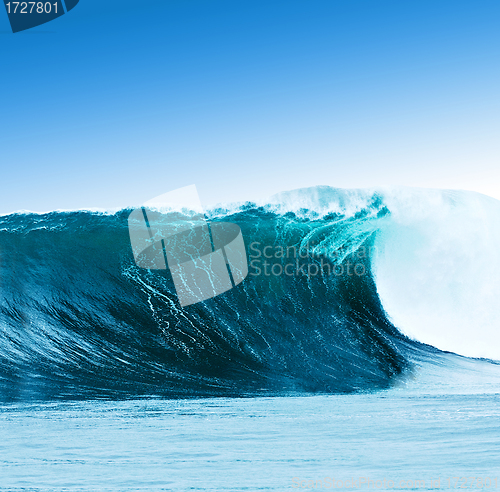 Image of Large surfing wave breaks in the ocean