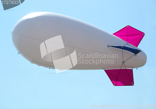 Image of white airship in the blue sky