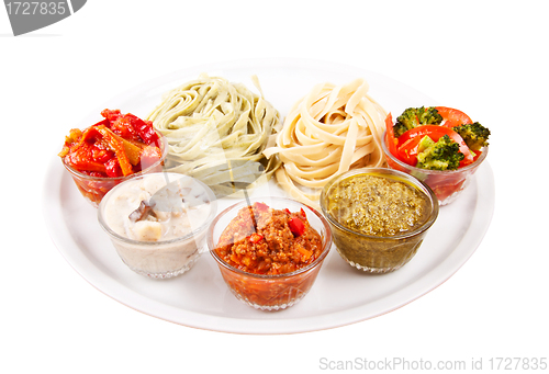 Image of two italian tagliatelles and five various condiments