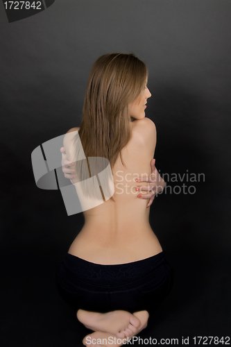 Image of Classic low-key photo of sexy woman on back