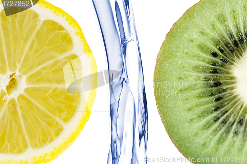 Image of sliced lime with lemon splashing in water isolated