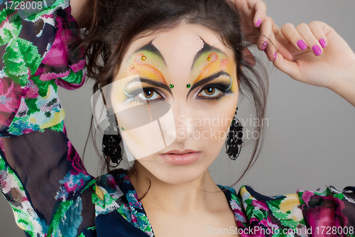 Image of Portrait of cute girl with idnian make up