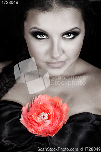 Image of Young beautiful woman with rose