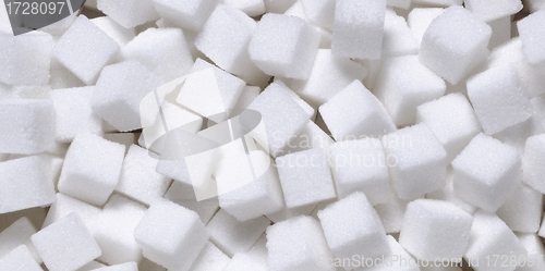 Image of white sugar in cubes texture background