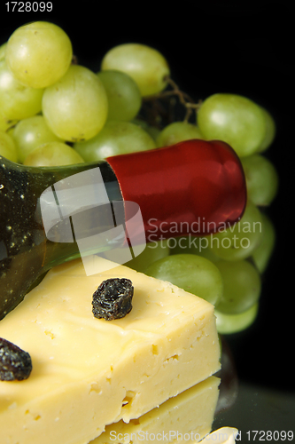 Image of Grape wine with cheese on black