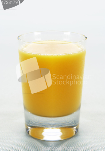 Image of Full glass of orange juice on white background
