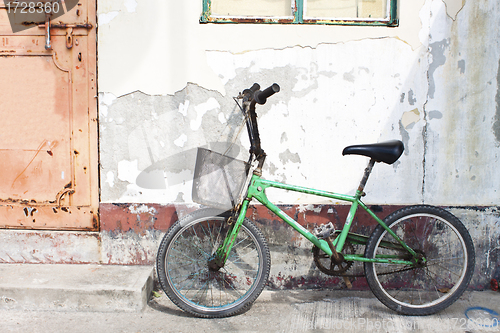 Image of Old bicycle along the street