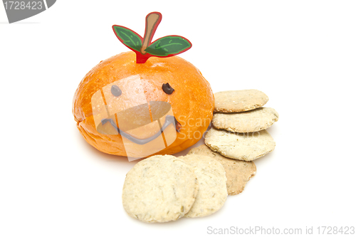 Image of Smiley face on bread and biscuits on white background