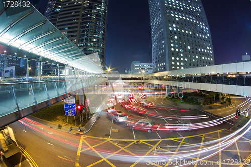 Image of Traffic in downtown of a modern city at night