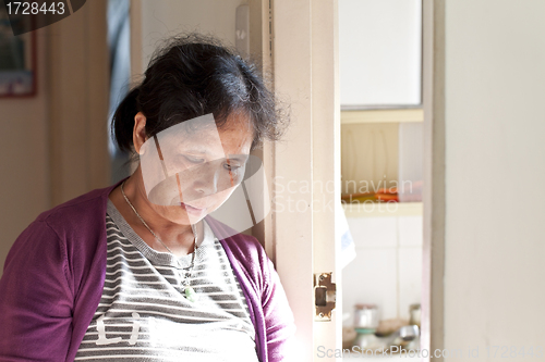 Image of A 50s asian woman at home taking rest