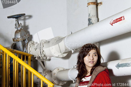 Image of Asian girl in a factory