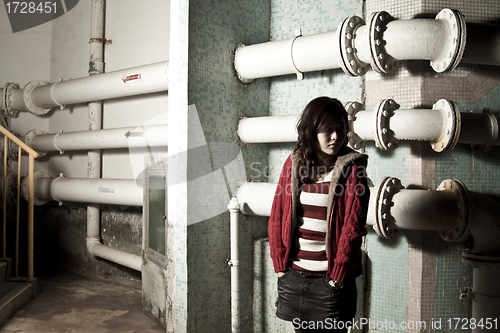 Image of Asian woman in dark showing sorrow mood